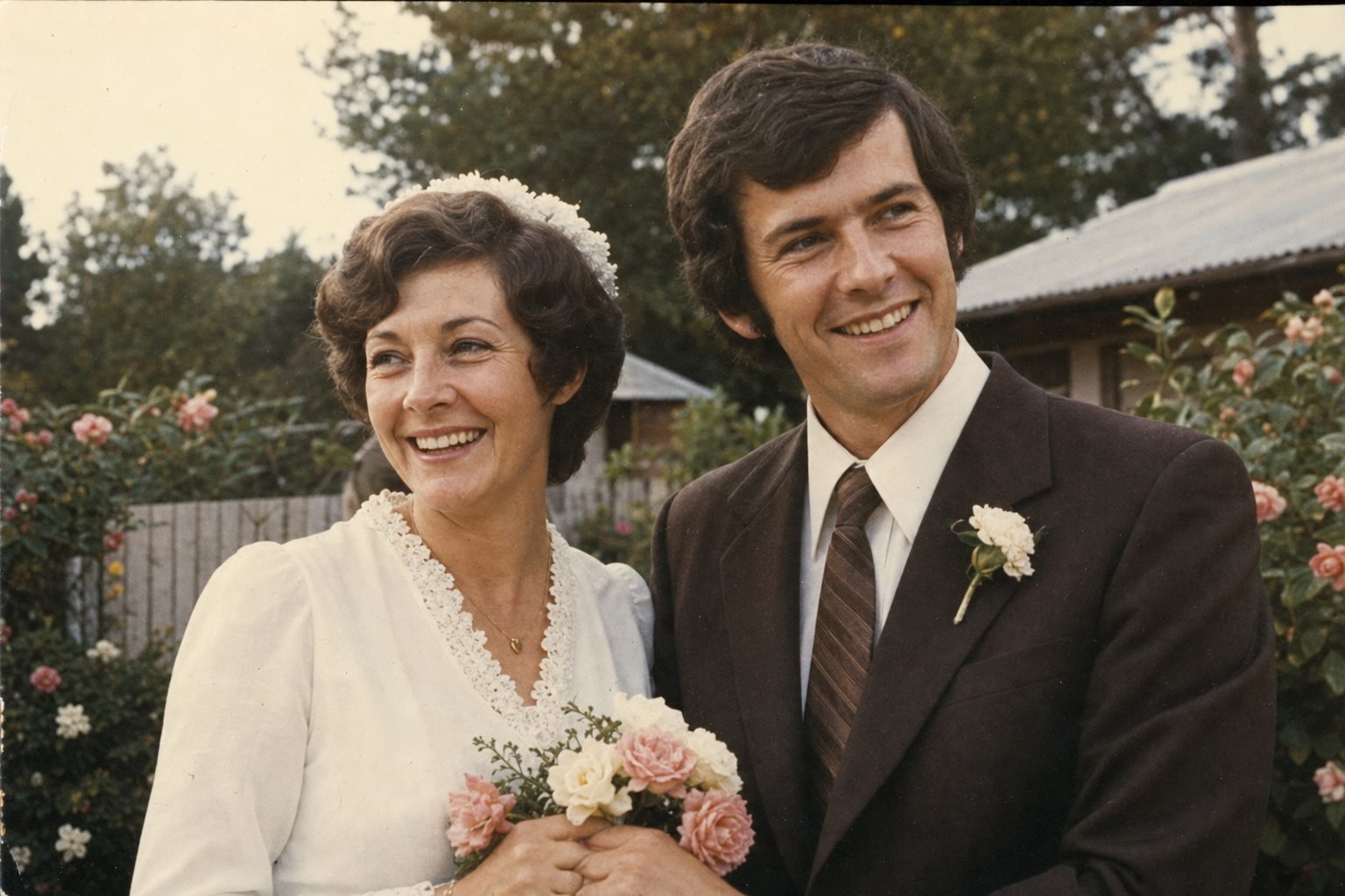 Margaret and Thomas laughing together on their wedding day